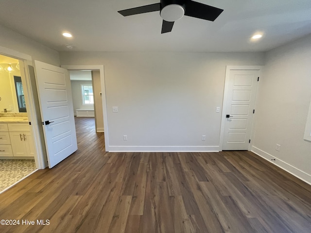 spare room featuring a ceiling fan, baseboards, dark wood-style flooring, and recessed lighting