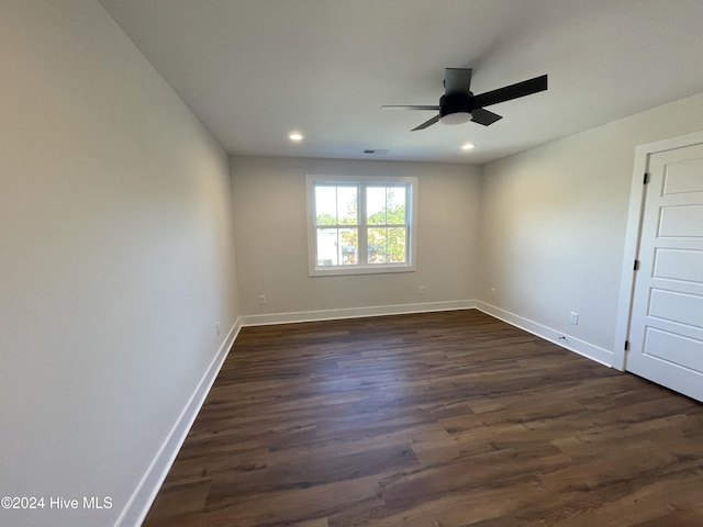 spare room featuring recessed lighting, visible vents, a ceiling fan, baseboards, and dark wood-style floors