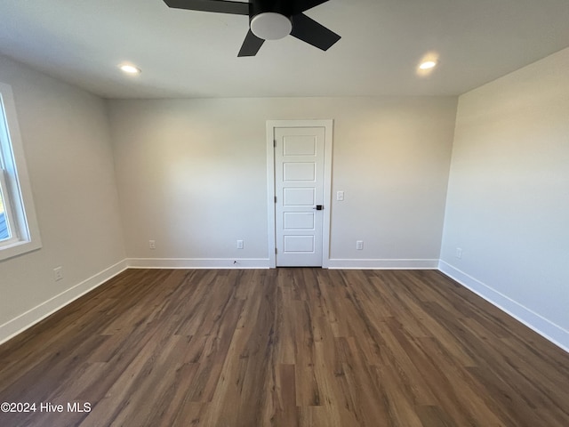 spare room with ceiling fan, baseboards, dark wood-style flooring, and recessed lighting