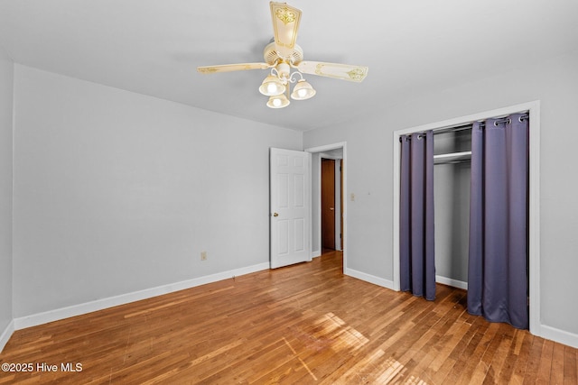 unfurnished bedroom with a ceiling fan, a closet, baseboards, and light wood finished floors