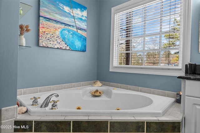 bathroom featuring a tub with jets