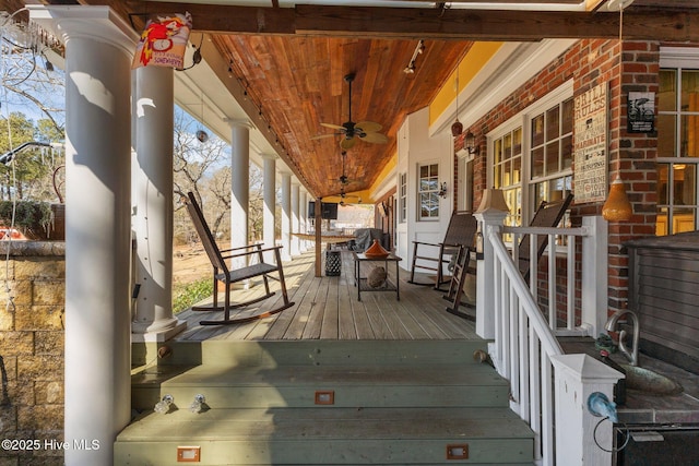 deck featuring a porch and ceiling fan