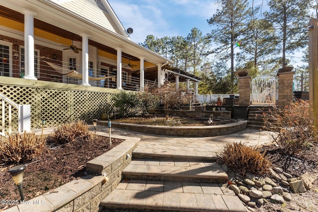 exterior space with a ceiling fan