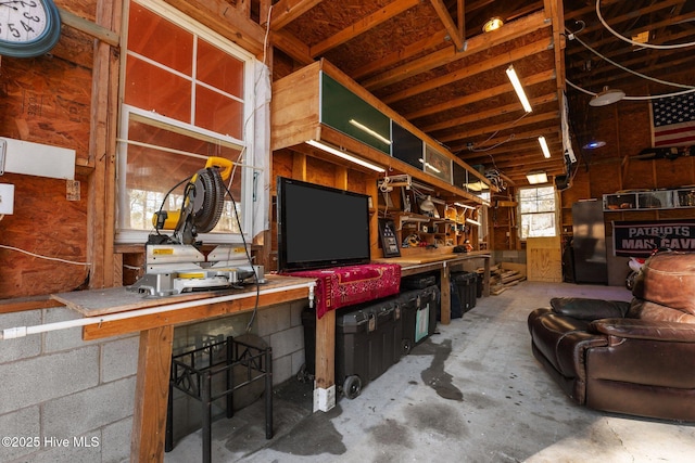 misc room featuring concrete floors and a workshop area