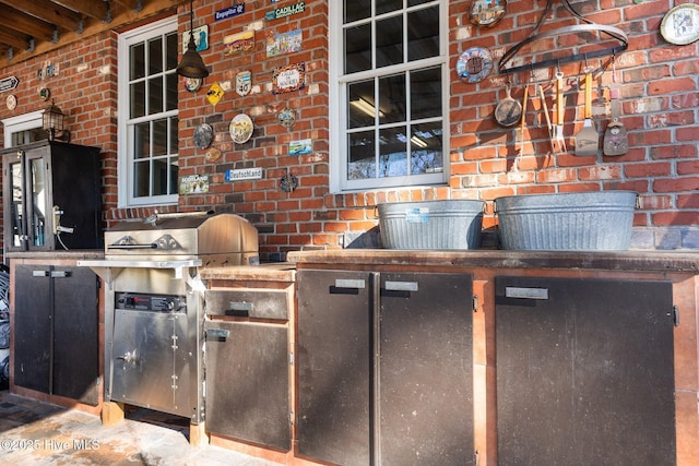 view of patio featuring exterior kitchen and area for grilling