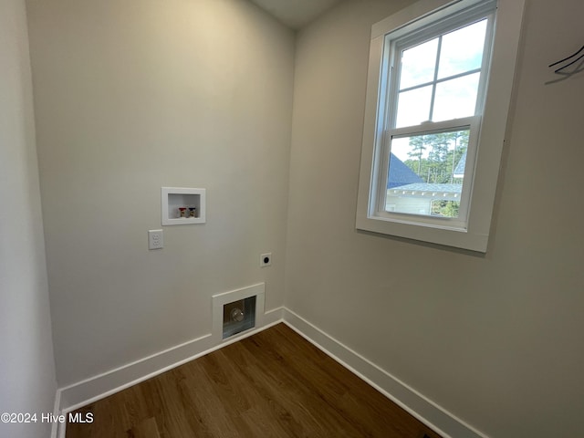 clothes washing area with hookup for a washing machine, laundry area, baseboards, dark wood finished floors, and electric dryer hookup