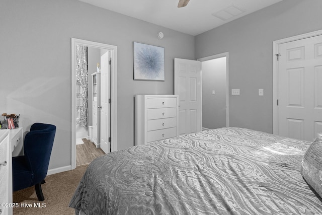 bedroom featuring a ceiling fan, carpet flooring, visible vents, and baseboards