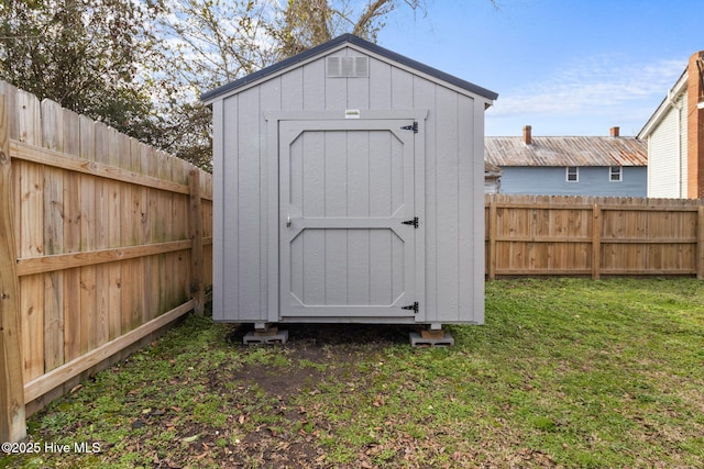 view of shed featuring a fenced backyard