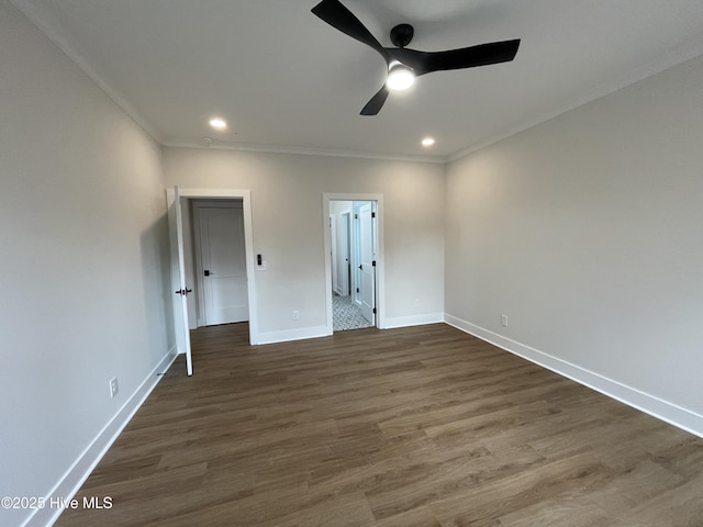 unfurnished bedroom featuring ornamental molding, recessed lighting, dark wood finished floors, and baseboards