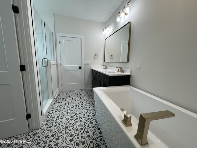 bathroom featuring tile patterned flooring, a sink, a shower stall, double vanity, and a bathtub