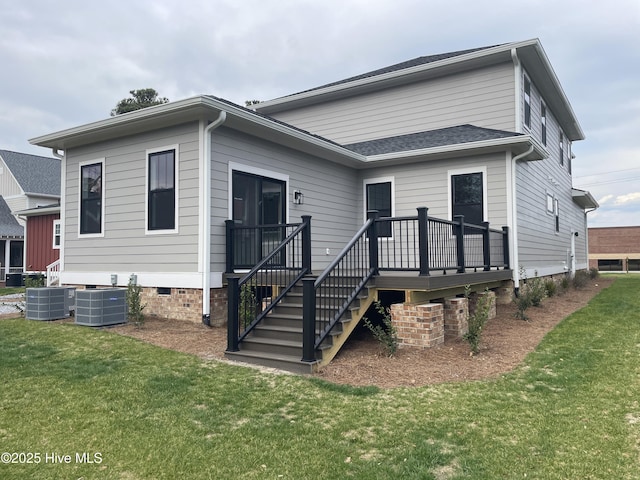 view of front of home featuring a deck, a front lawn, crawl space, and central AC unit