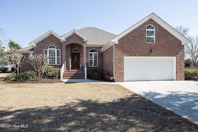 ranch-style home featuring a garage, driveway, brick siding, and a shingled roof