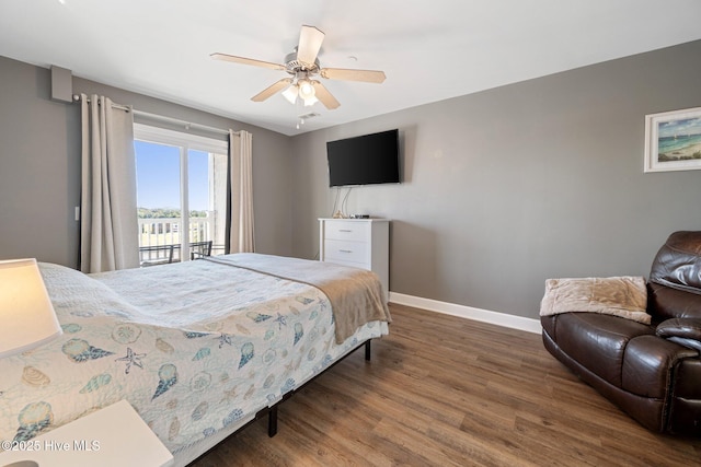 bedroom featuring access to exterior, ceiling fan, baseboards, and wood finished floors