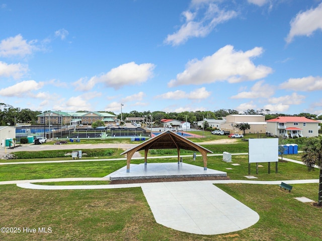 view of home's community with a residential view, a lawn, and a gazebo