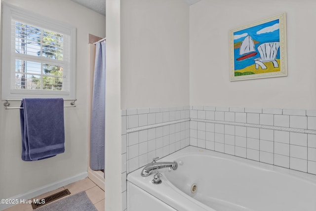 bathroom with visible vents, baseboards, a stall shower, tile patterned floors, and a tub with jets