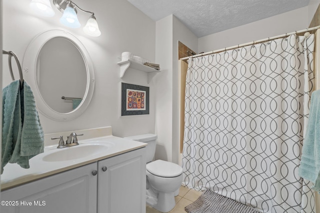 full bath with vanity, a textured ceiling, curtained shower, tile patterned floors, and toilet