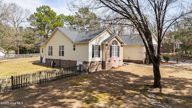 view of home's exterior featuring crawl space, a yard, and fence private yard