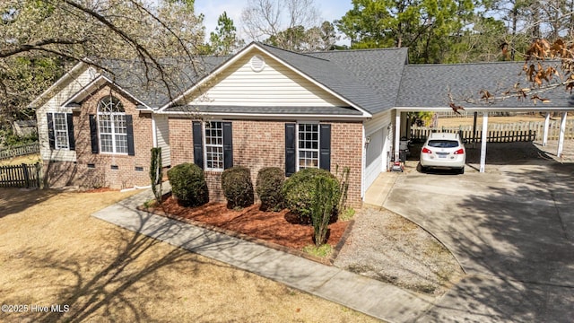 view of front of home featuring fence, concrete driveway, a garage, crawl space, and brick siding