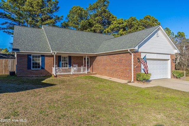 ranch-style home featuring driveway, a garage, a front lawn, and brick siding