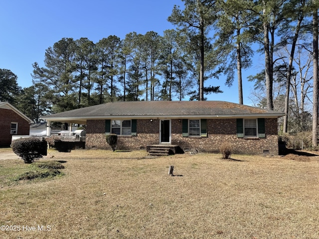 ranch-style home featuring a front yard, crawl space, brick siding, and an attached carport