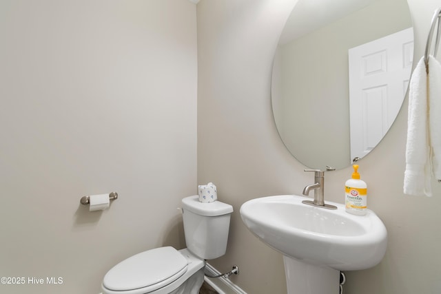 bathroom featuring a sink and toilet