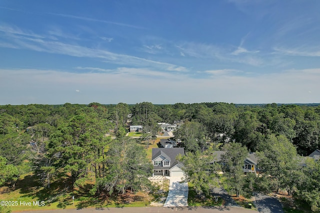 drone / aerial view with a view of trees