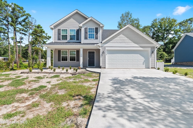 view of front of property with a garage and concrete driveway