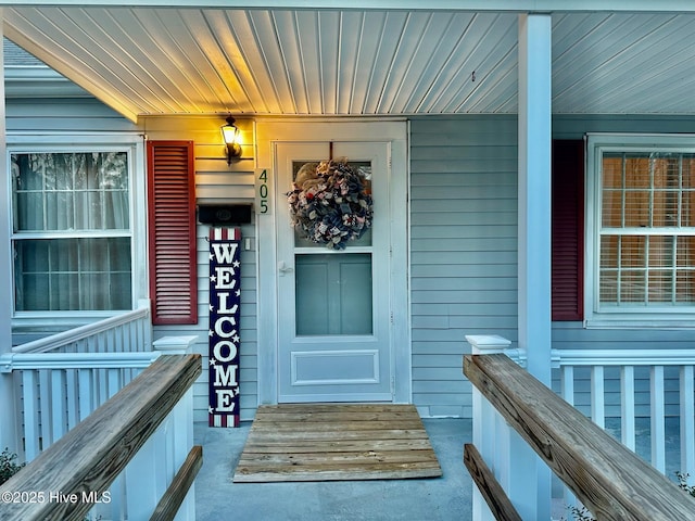 doorway to property featuring covered porch