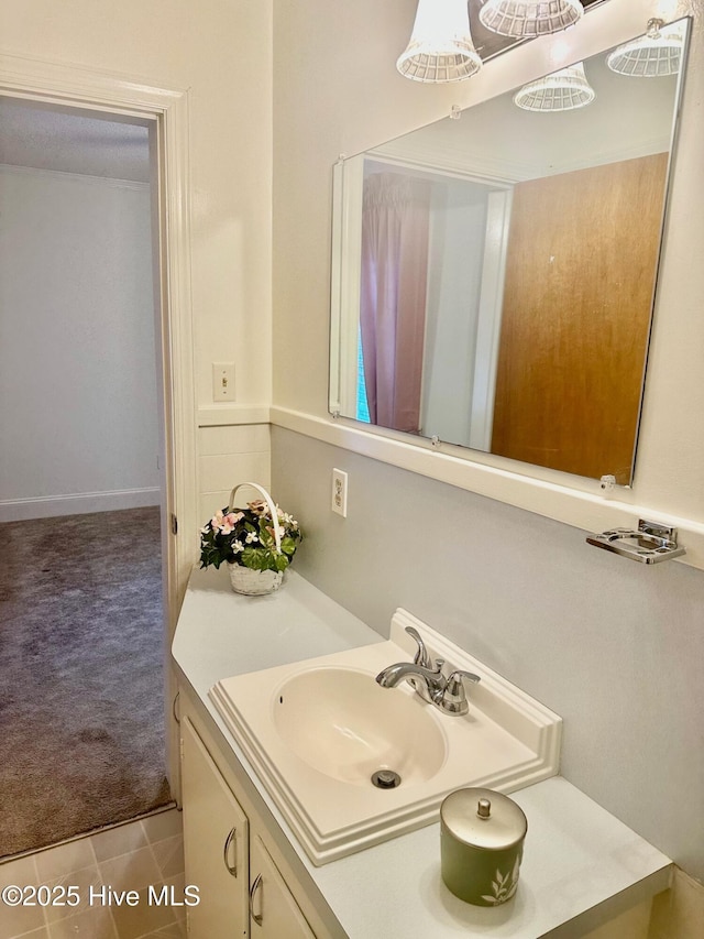 bathroom featuring tile patterned flooring and vanity