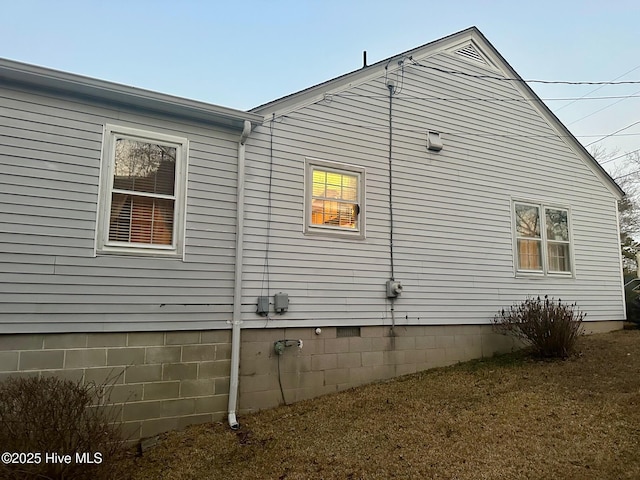 view of property exterior with crawl space