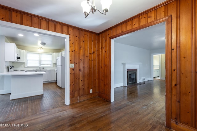 kitchen with dark wood finished floors, open floor plan, electric stove, and freestanding refrigerator