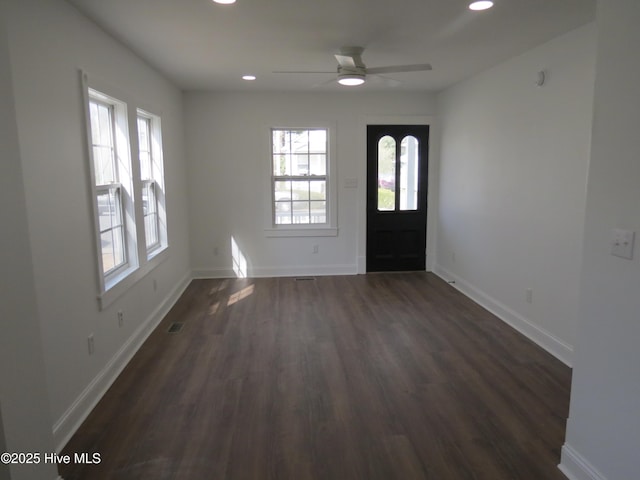 foyer entrance featuring baseboards, plenty of natural light, and recessed lighting