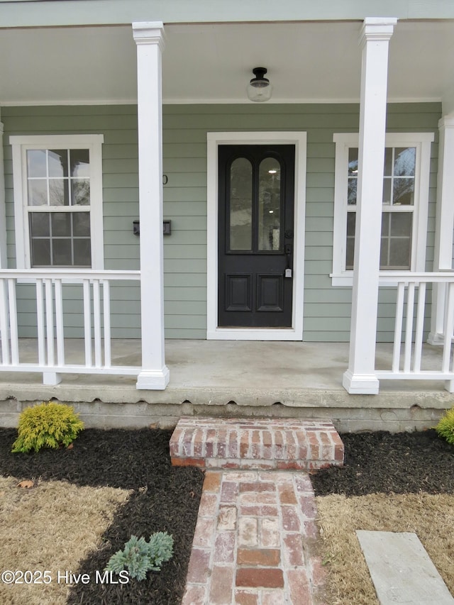 property entrance featuring covered porch