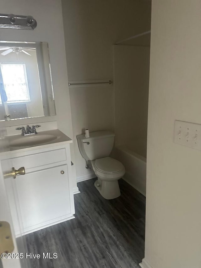 full bathroom featuring ceiling fan, vanity, toilet, and wood finished floors