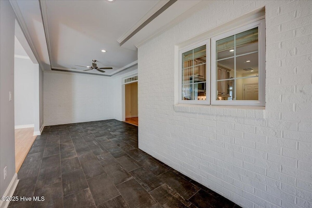 unfurnished room with brick wall, ornamental molding, ceiling fan, and recessed lighting