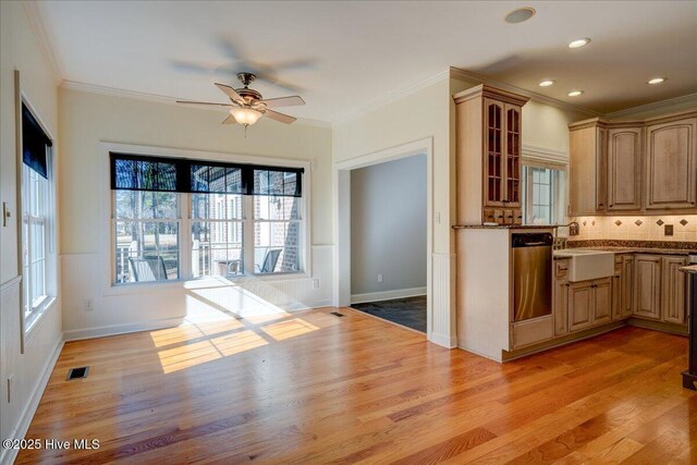 unfurnished living room featuring baseboards, a fireplace with flush hearth, ornamental molding, beamed ceiling, and wood finished floors