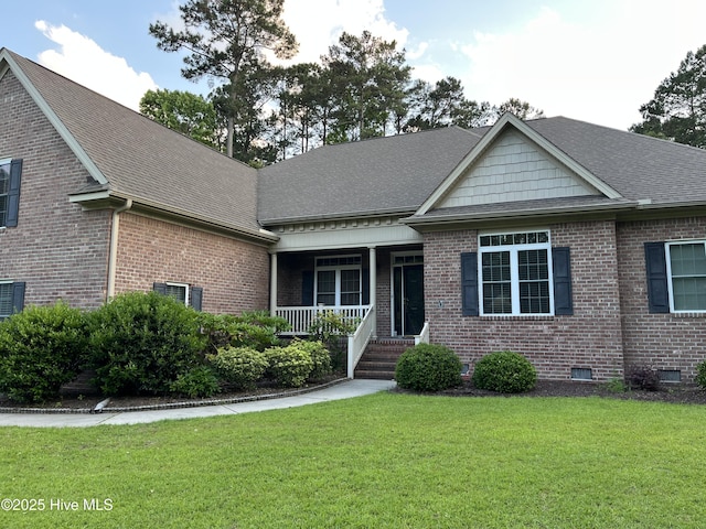 3602 Cranberry Ln, New Bern, NC 28562 - view of front of property with a porch, brick siding, a front yard, and roof with shingles