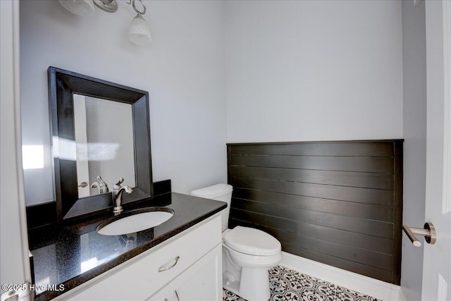 bathroom with toilet and vanity