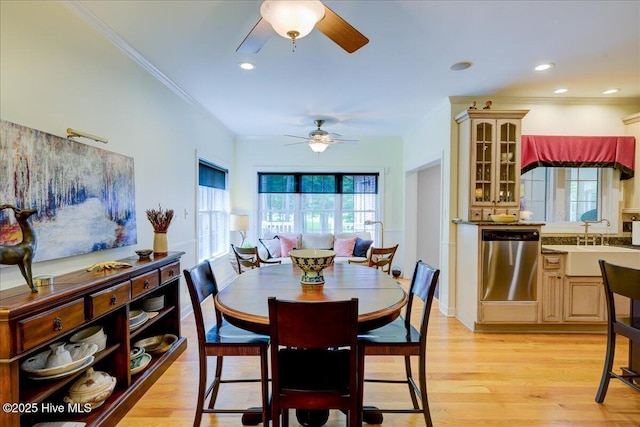 dining space with ornamental molding, light wood finished floors, a ceiling fan, and recessed lighting