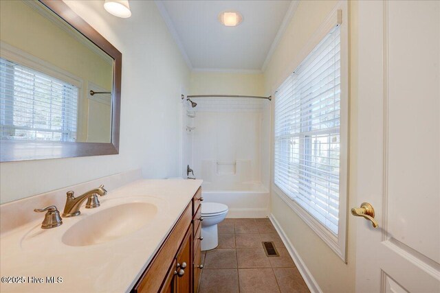 kitchen with glass insert cabinets, crown molding, appliances with stainless steel finishes, and a sink