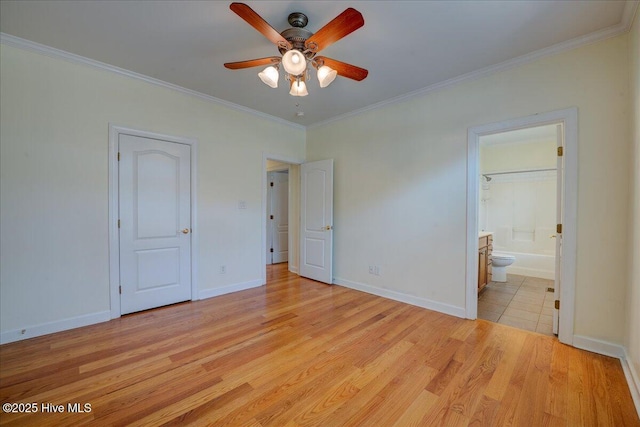 3602 Cranberry Ln, New Bern, NC 28562 - unfurnished bedroom featuring crown molding, light wood-style floors, ensuite bathroom, and baseboards