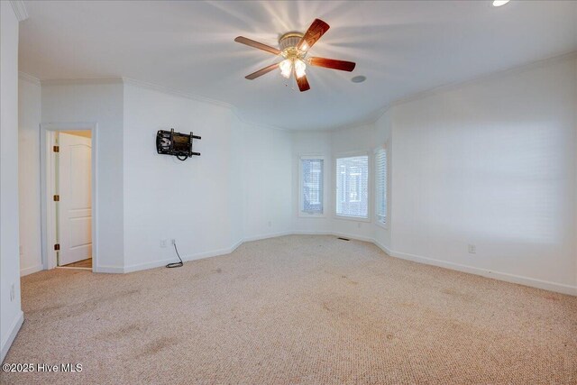 unfurnished bedroom with baseboards, light wood-type flooring, ensuite bath, and crown molding