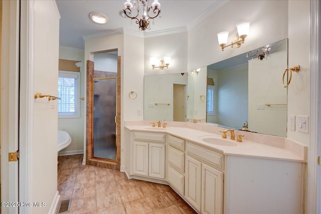 full bathroom with visible vents, a sink, crown molding, and a stall shower