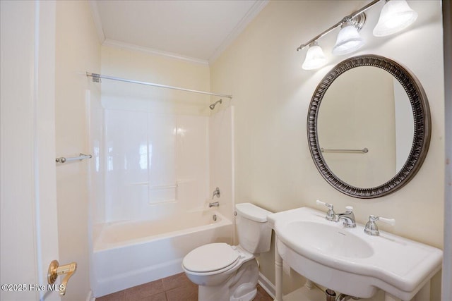 full bathroom featuring tile patterned flooring, toilet, a sink, tub / shower combination, and crown molding