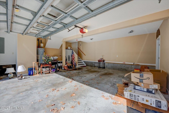 garage with a garage door opener, water heater, and electric panel