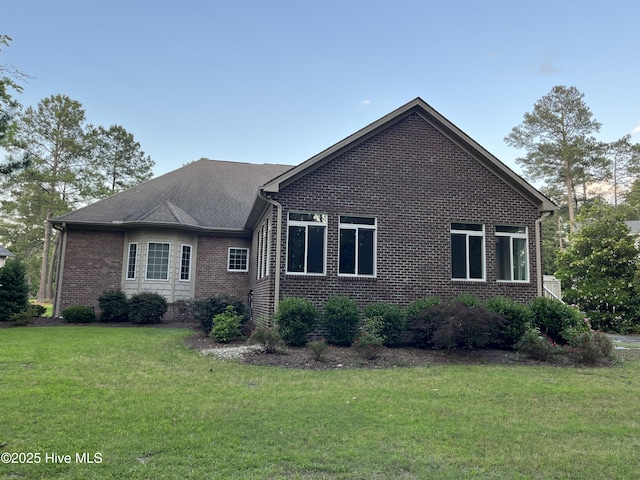 3602 Cranberry Ln, New Bern, NC 28562 - view of side of property with brick siding and a yard