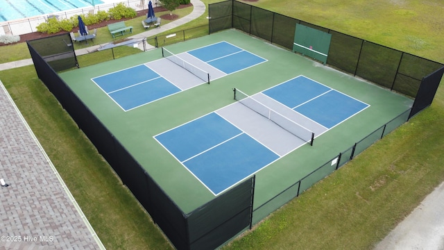 view of sport court with fence