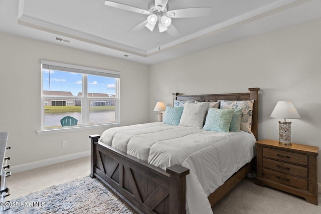 bedroom featuring ceiling fan, light colored carpet, visible vents, baseboards, and a raised ceiling