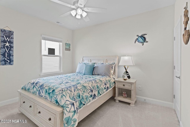 bedroom featuring a ceiling fan, light carpet, visible vents, and baseboards