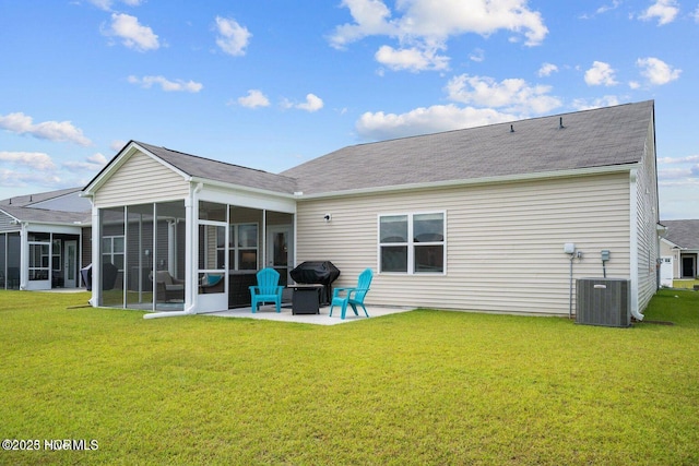 back of house featuring a sunroom, central AC, a lawn, and a patio